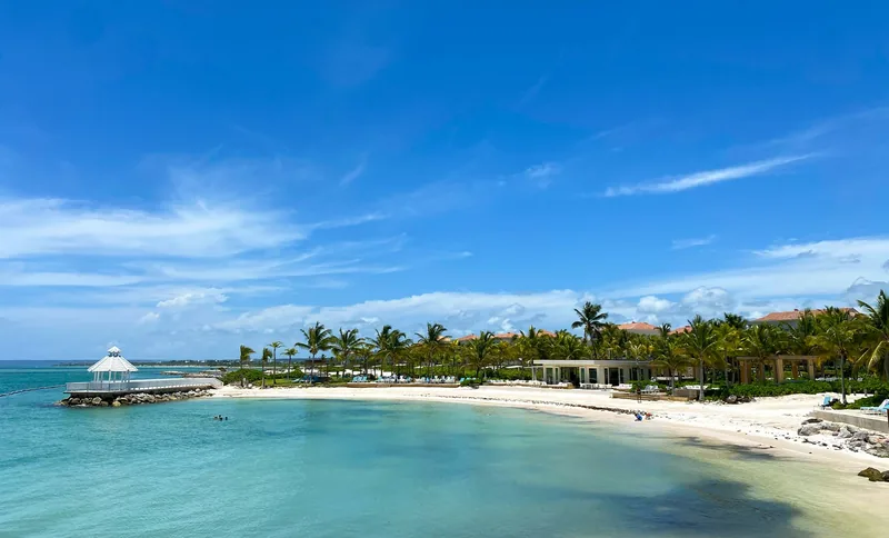 A palm-lined beach and pier in Punta Cana