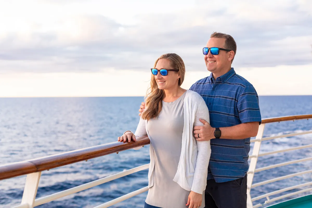 A couple at the rail of a cruise ship